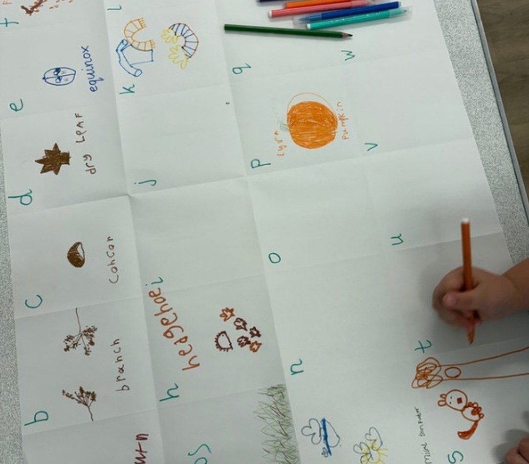 An autumn alphabet sheet with drawings of leaves and conkers